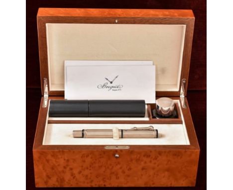 A magnificent Breguet writing box. Walnut box containing a 925 silver Breguet fountain pen, an inkwell with silver top and a 