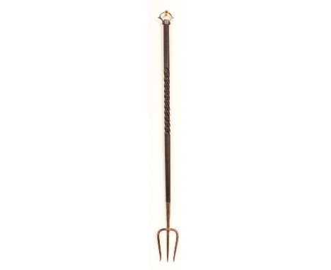 A silver mounted toasting fork, the turned wooden handle with decoration mounted to the tip of the shaft with ring handle and