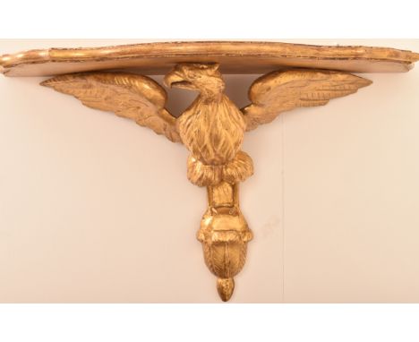 A 19th Century carved giltwood wall bracket modelled as an eagle. H=40, W=62cm
