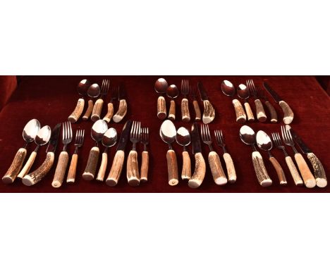 A set of eight Fontenille Pataud deer antler handled knives, forks and dessert spoons and a Rostfrei starter fork and spoon.