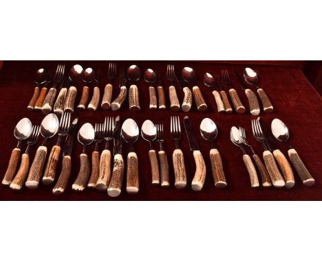 A set of eight Fontenille Pataud deer antler handled knives, forks and dessert spoons and a Rostfrei starter fork and spoon.