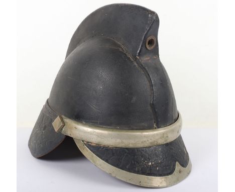 Vintage Fireman’s Helmet: Heavy black leather with white metal furniture complete  liner.