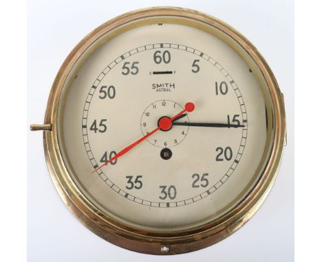 Ships Bulkhead Clock: Brass cased SMITH ASTRAL clock with red second hand, 23 cms wide, not working. 