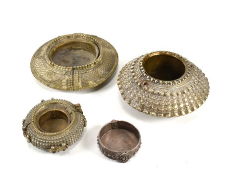 Four African metal bangles converted into trinket dishes. The metal bangles/anklets having been converted into trinket dishes