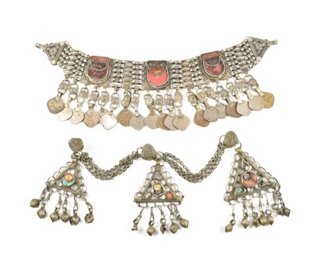 Two white tone metal and foiled glass breast plates/head dresses. The lot to include a Pakistani white tone metal chain breas