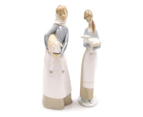 Two Lladro porcelain figures, comprising figure of a lady holding a sheep, 28cm high, and a further figure of a lady holding 