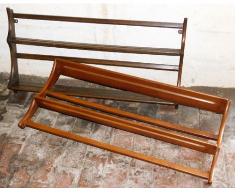 An Ercol light elm wall mounted plate rack, and another in dark elm, both 96cm wide.