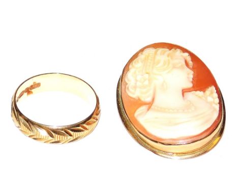 A 9ct gold wedding band, with engraved decoration, size P, 2.5g, together with an oval cameo brooch, bust portrait of a lady 