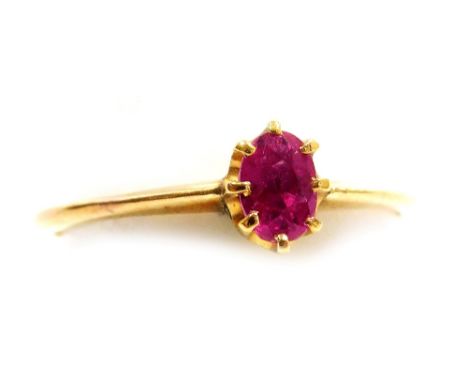 A ruby solitaire ring, claw set in yellow metal, size N, 1.5g.