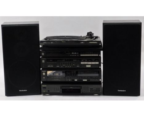 A Technics music system, comprising a quartz synthesizer, ST-7450L, stereo integrated amplifier, SU-Z450, compact disk player