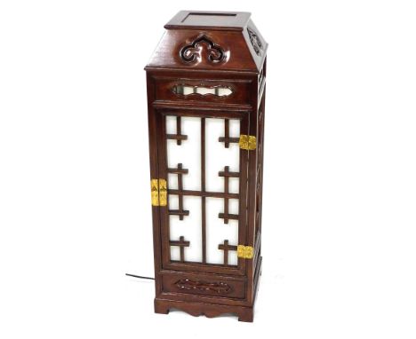 A Korean hardwood cased floor light, of square section with pierced and fabric back panelled sides, raised on bracket feet, 8