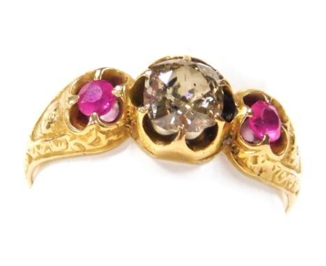 A Victorian 18ct gold diamond and ruby three stone ring, the central rose cut diamond approximately 0.6 carats, size P, 3.4g.