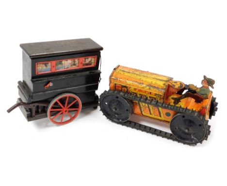 An American Marx Toys tin plate wind up tractor, painted orange and yellow, with removable figure, and rubber tracks, 21cm wi