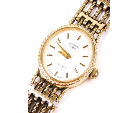 A Rotary 9ct gold cased lady's wristwatch, the oval white dial with white batons, quartz movement, on a gate leg strap, 14.8g