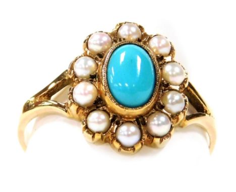 A 9ct gold turquoise and seed pearl ring, the oval cabachon turquoise in a surround of seed pearls, size R, 2.4g.