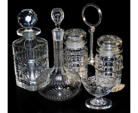 A Victorian cut glass globe and shaft decanter and stopper, further decanter and stopper, an Edwardian boat shaped pedestal s