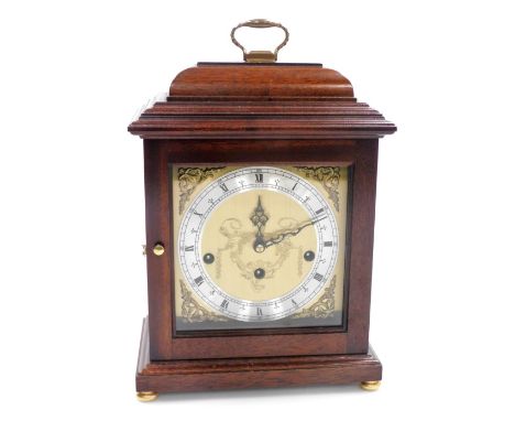 A 20thC mahogany cased mantel clock, the brass dial bearing Roman numerals, silvered chapter ring, eight day Franz Hermle mov