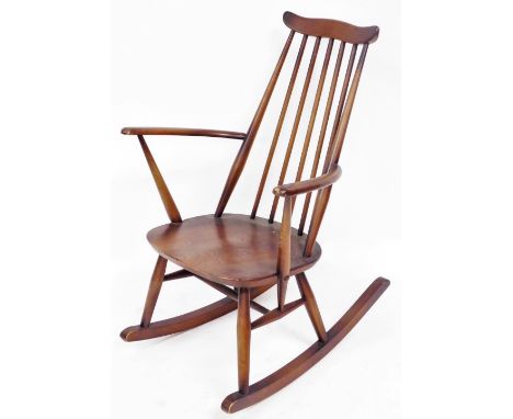 An Ercol dark elm and beech rocking chair, 62cm wide.
