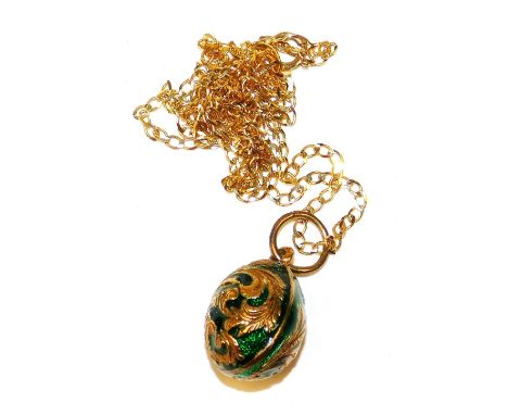 A 9ct gold and enamel egg shaped pendant, on a curb link neck chain, with bolt ring clasp, 5.0g all in.