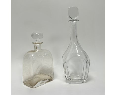 A tall glass decanter with faceted body and square form faceted stopper (h. 34cm), together with a squat form decanter with c