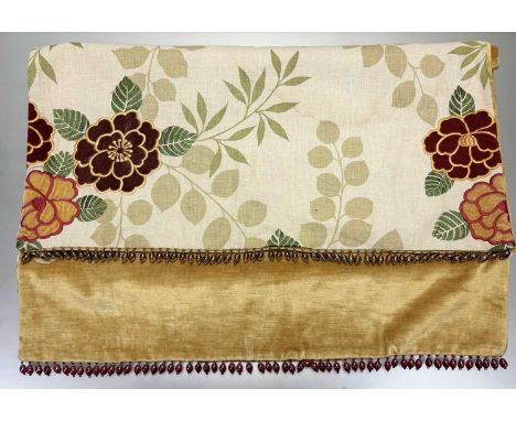 A trio of coverlets one with a crushed velvet floral and stitched leaf with a gold crushed velvet underside with a beaded fri