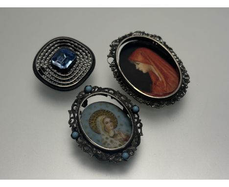 An Italian white metal oval pendant/ brooch set with turquoise coloured beads with a portrait on clear acetate of the Madonna