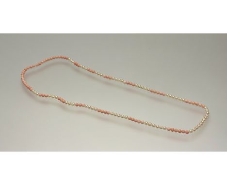 A classic cultured pearl and pale pink coral alternating strand necklace: l. x 37cm