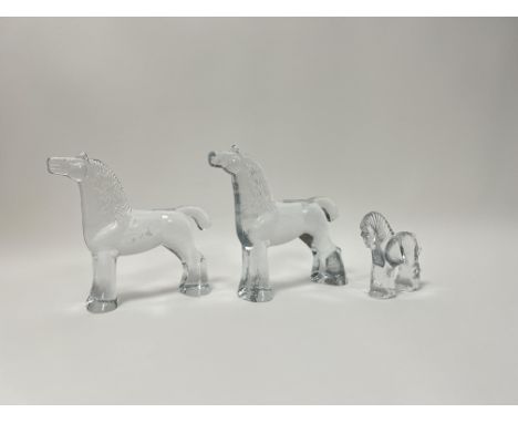 A pair of large glass sculptures in the form of horses (h. 20cm), together with a smaller glass horse paperweight (h. 10cm), 
