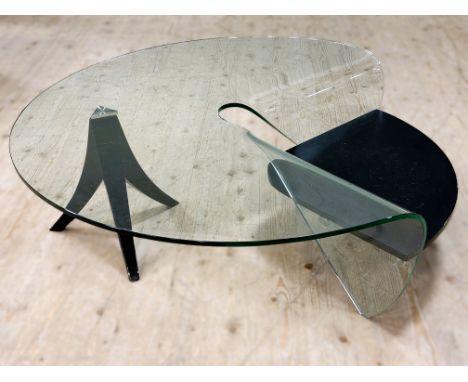 A stylish modern plate glass sculpted curved coffee table with curved black finished suspended panel raised on black finished