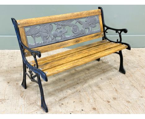 A reproduction child's cast metal painted oak slatted garden bench, with cast metal panel back with elephants, giraffe etc. (