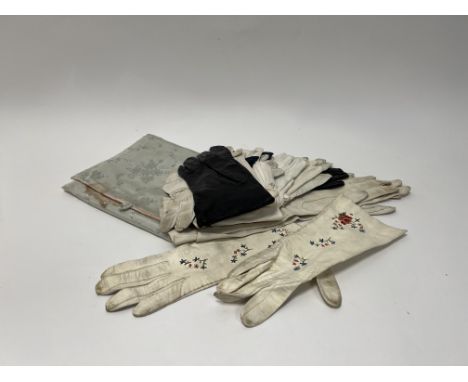 A collection of vintage lady's gloves comprising, a pair of cream leather gloves with polychrome embroidered flowers (l. 26cm