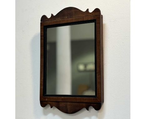 An Early 19thc mahogany fretwork style mirror with ebonised slip with later panel. (48cmx32cm)