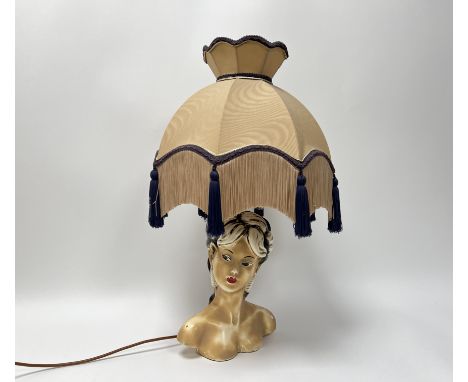 A plaster lamp in the form of a Japanese Geisha lady, painted table lamp and a coloured scalloped silk lampshade with purple 