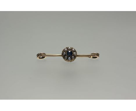 A 9ct gold bar brooch set central round cut sapphire approximately 0.25ct within a surround of eight seed pearls: l. x 4cm 2.