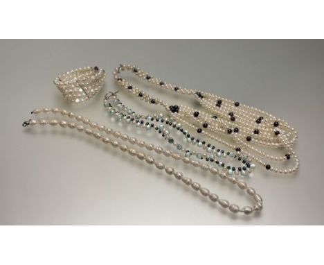 A collection of Chinese freshwater cultured pearl necklaces to include, an eastern style woven section with white metal clasp