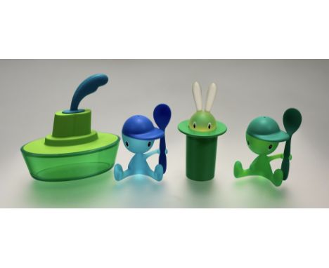 A collection of Alessi kitchen accessories comprising, a Cico green and blue egg cup holder with spoon, a green Magic Bunny T
