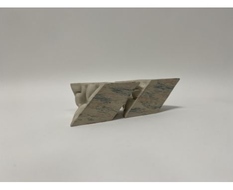 A ceramic modern sculpture in two pieces with abstract edges and blue and pink exterior, signed indistinctly (when together, 