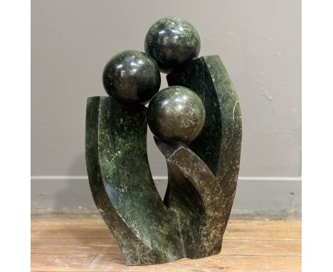 William Wilberforce Chewa (African), An abstract shona scultpure of three intertwined figures, signed to base. (h-52cm)