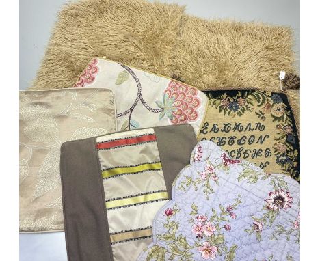 A collection of various cushion covers comprising a Alphabet stichwork to centre with tassles to edges and brown verso, a pal