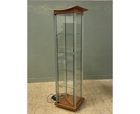 A modern showcase with bentwood cherrywood arched top and glazed panel door with frosted glass edge complete with four glass 