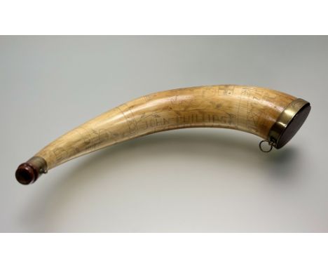 An 18thc style cow horn powder flask, carved John Phillips Exeter, 1752 with other mixed carvings and brass mounts: l. x 54.5