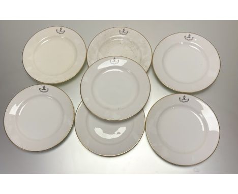 A set of seven Royal Worcester dinner plates, with hand to top and motto bellow reading - "Manent Optima Ccelp" with gilt edg