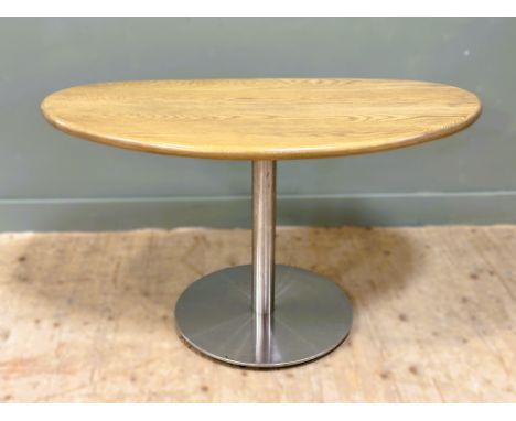 Glenmorangie: a light oak side table with moulded edge, on chrome centre column and circular base (h.74cm x l.131cm x w.68cm)