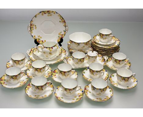 A Royal Doulton Art Deco style Honesty pattern part tea service comprising, two serving plates (w-25.5cm), a large sugar bowl