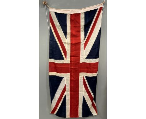 A large 20thc linen woven multi-panel union jack flag, with rope ties to top (183cm x 84cm)