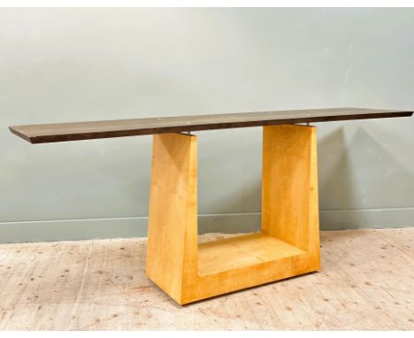 Glenmorangie: An blackened oak console table of architectural form, on satinwood tapered steel mounted centre shaped supports