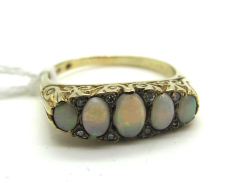 A 9ct Gold Five Stone Opal Ring, graduated oval cabochon set, with single cut diamond highlights, in Victorian style scroll c