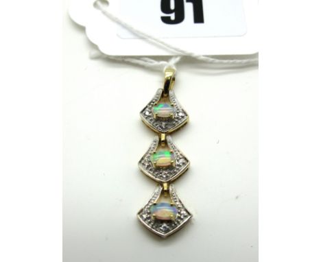 A Modern 9ct Gold Opal Set Pendant, of shaped design with claw set cabochons and millegrain set highlights.