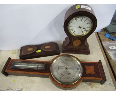 An Edwardian mahogany and inlaid mantel clock, together with a similar barometer and small book slide