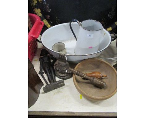 An enamel basin, jug and mug, together with a metal doorstop formed as a soldier, another doorstop and wooden items